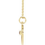 Dainty Pisces charm necklace with garnet gemstone in recycled gold side view