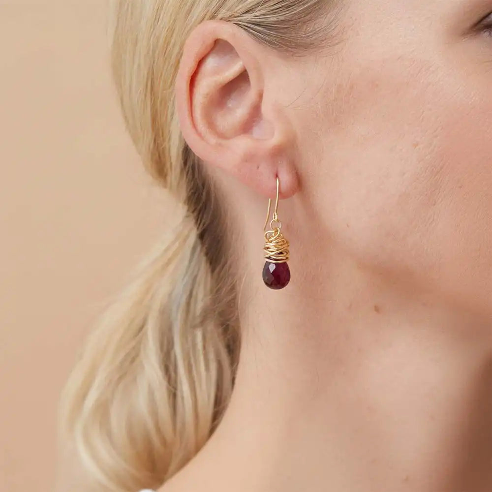 Close-up of natural garnet bezel dangle earring, showing rich wine-red stone and handcrafted detail variant--Gold-fill variant--Sterling-silver variant--Garnet