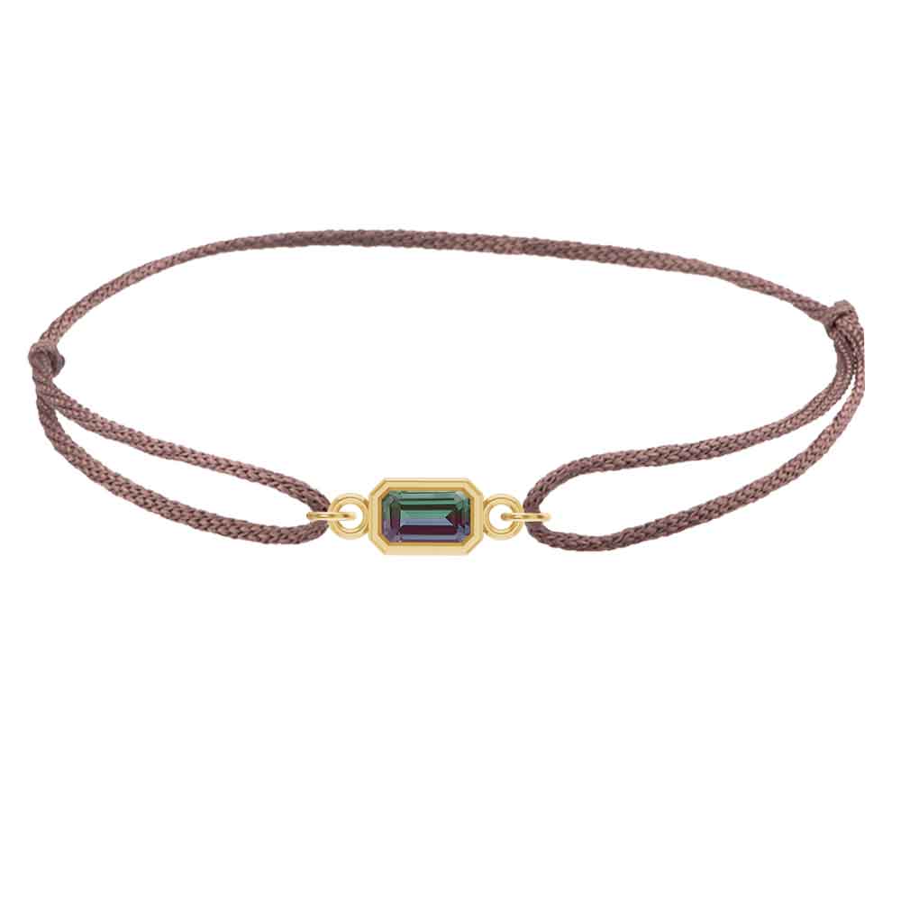 Design-your-own silk bracelet featuring bezel-set birthstone in 14K yellow gold on silk with slip-knot clasp