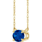 Detailed View Contemporary sapphire necklace set sideways in gold