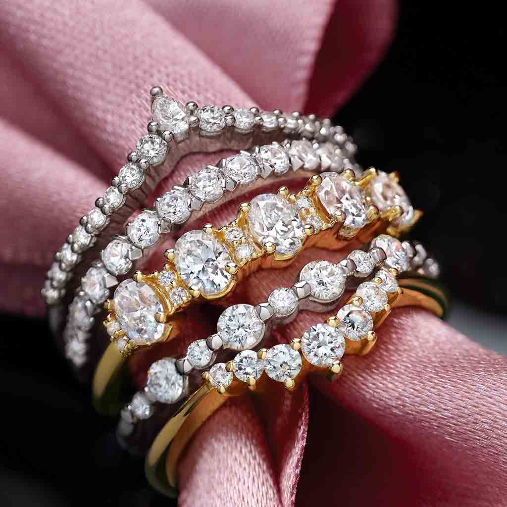 Platinum diamond V band with natural diamonds stacked with other rings
