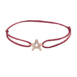 Diamond initial a silk bracelet in 14K rose gold on burgundy silk