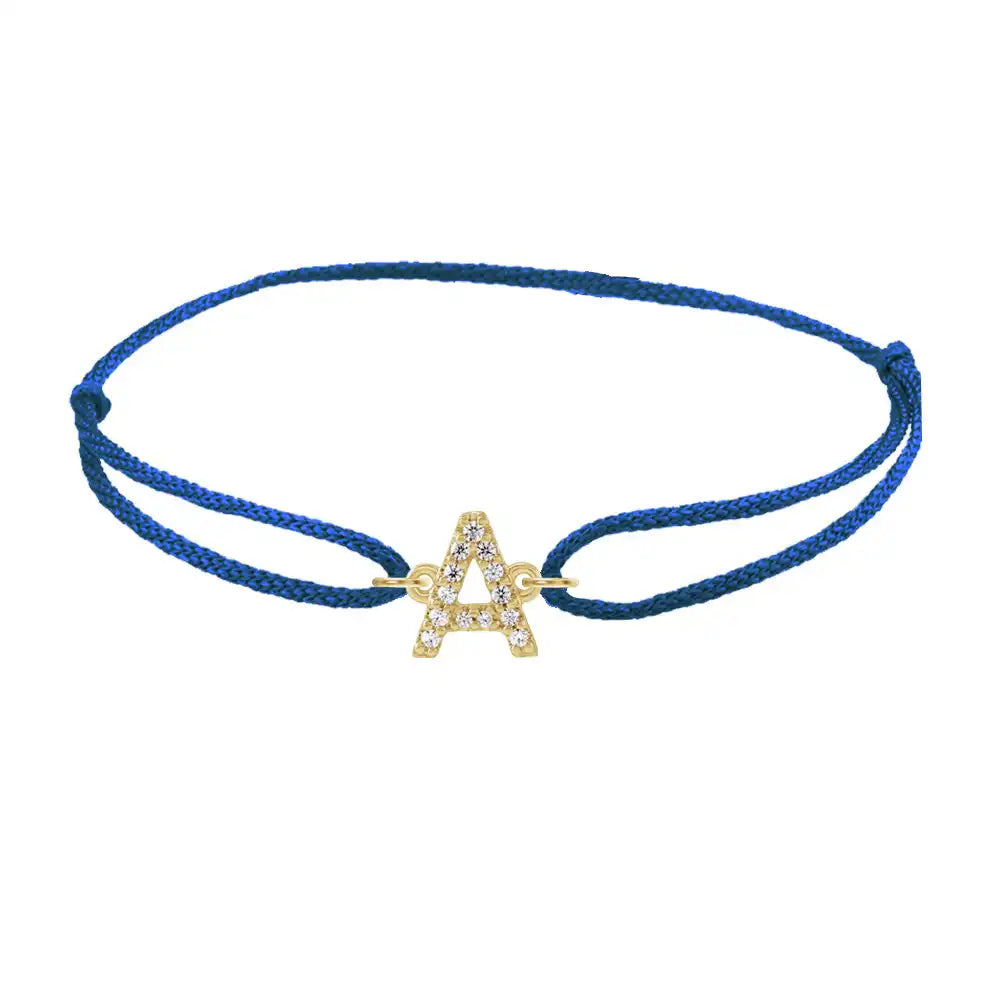 Diamond initial a silk bracelet in 14K yellow gold on blue silk