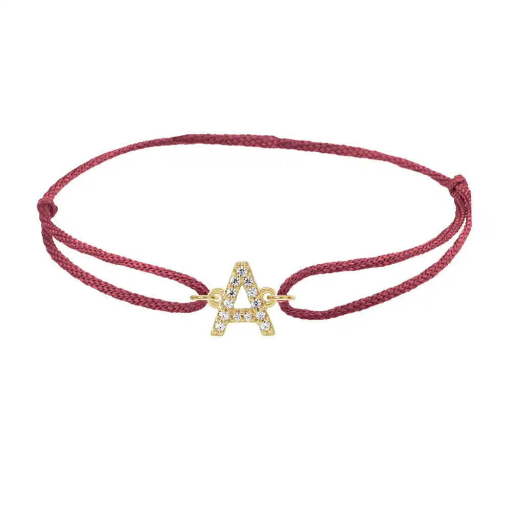 Diamond initial a silk bracelet in 14K yellow gold on burgundy silk