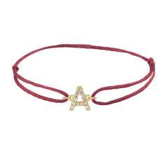 Diamond initial a silk bracelet in 14K yellow gold on burgundy silk