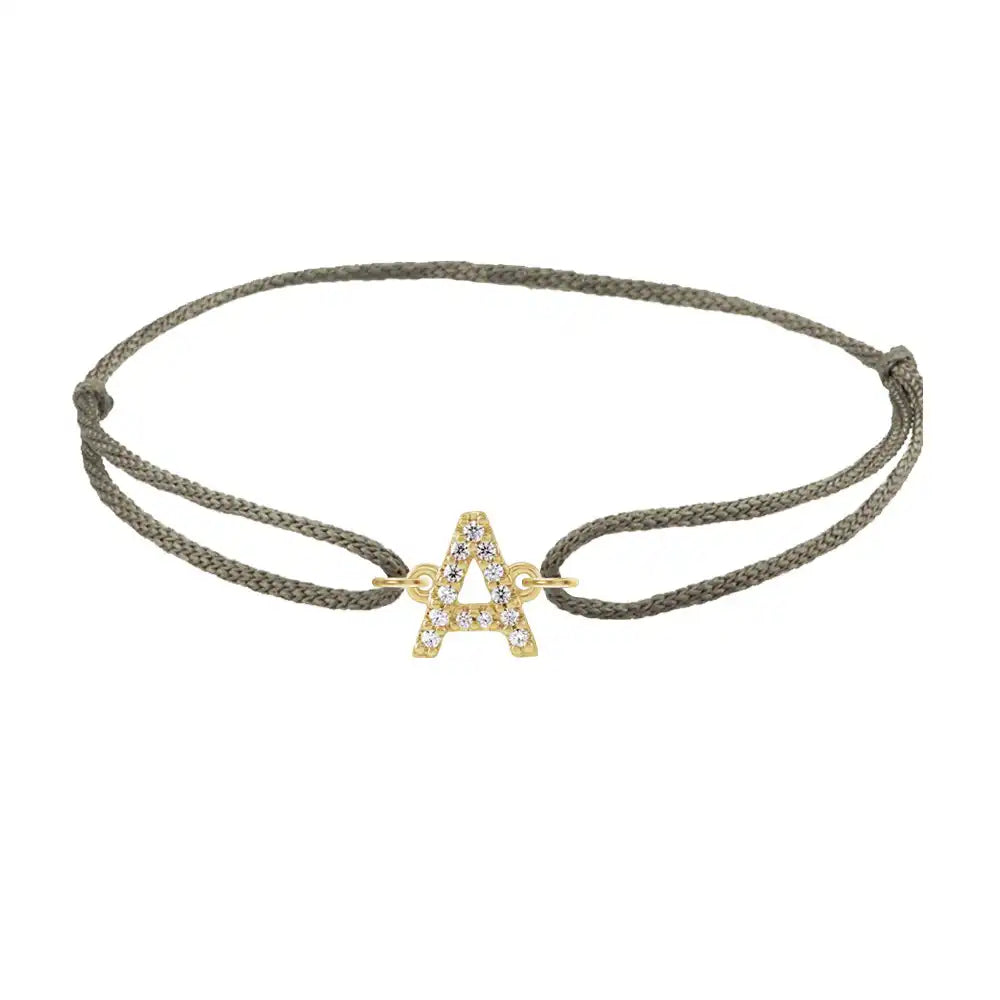 Diamond initial a silk bracelet in 14K yellow gold on olive silk