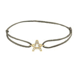 Diamond initial a silk bracelet in 14K yellow gold on olive silk