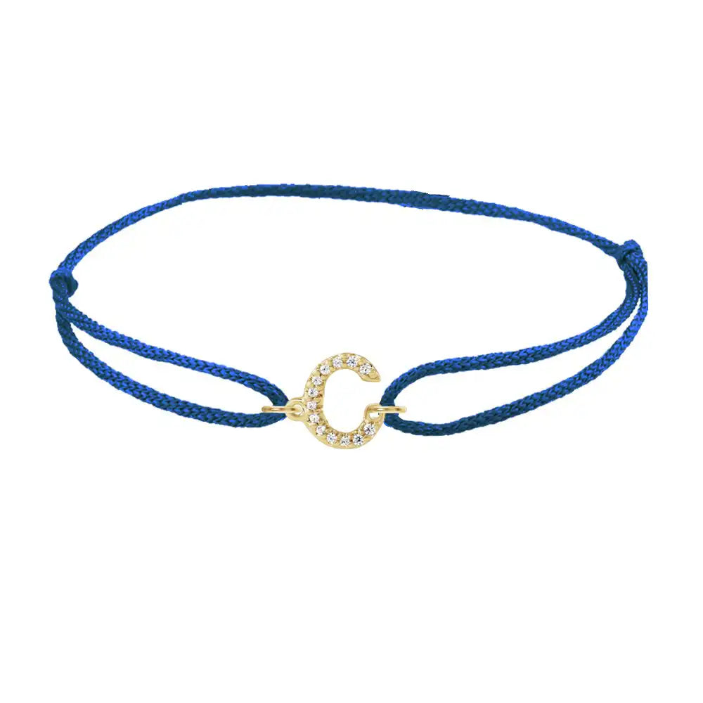 Diamond initial c silk bracelet in 14K yellow gold on blue silk