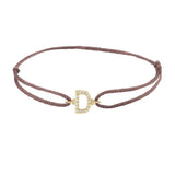 Diamond initial d silk bracelet in 14K yellow gold on brown silk
