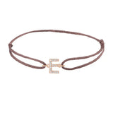 Diamond initial e silk bracelet in 14K rose gold on brown silk