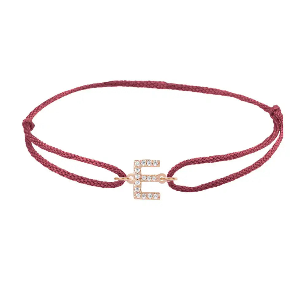 Diamond initial e silk bracelet in 14K rose gold on burgundy silk