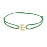 Diamond initial e silk bracelet in 14K yellow gold on emerald silk