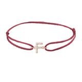 Diamond initial f silk bracelet in 14K rose gold on burgundy silk
