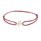 Diamond initial f silk bracelet in 14K yellow gold on burgundy silk