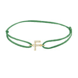 Diamond initial f silk bracelet in 14K yellow gold on emerald silk