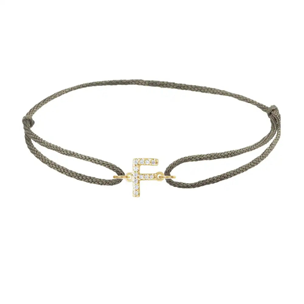 Diamond initial f silk bracelet in 14K yellow gold on olive silk
