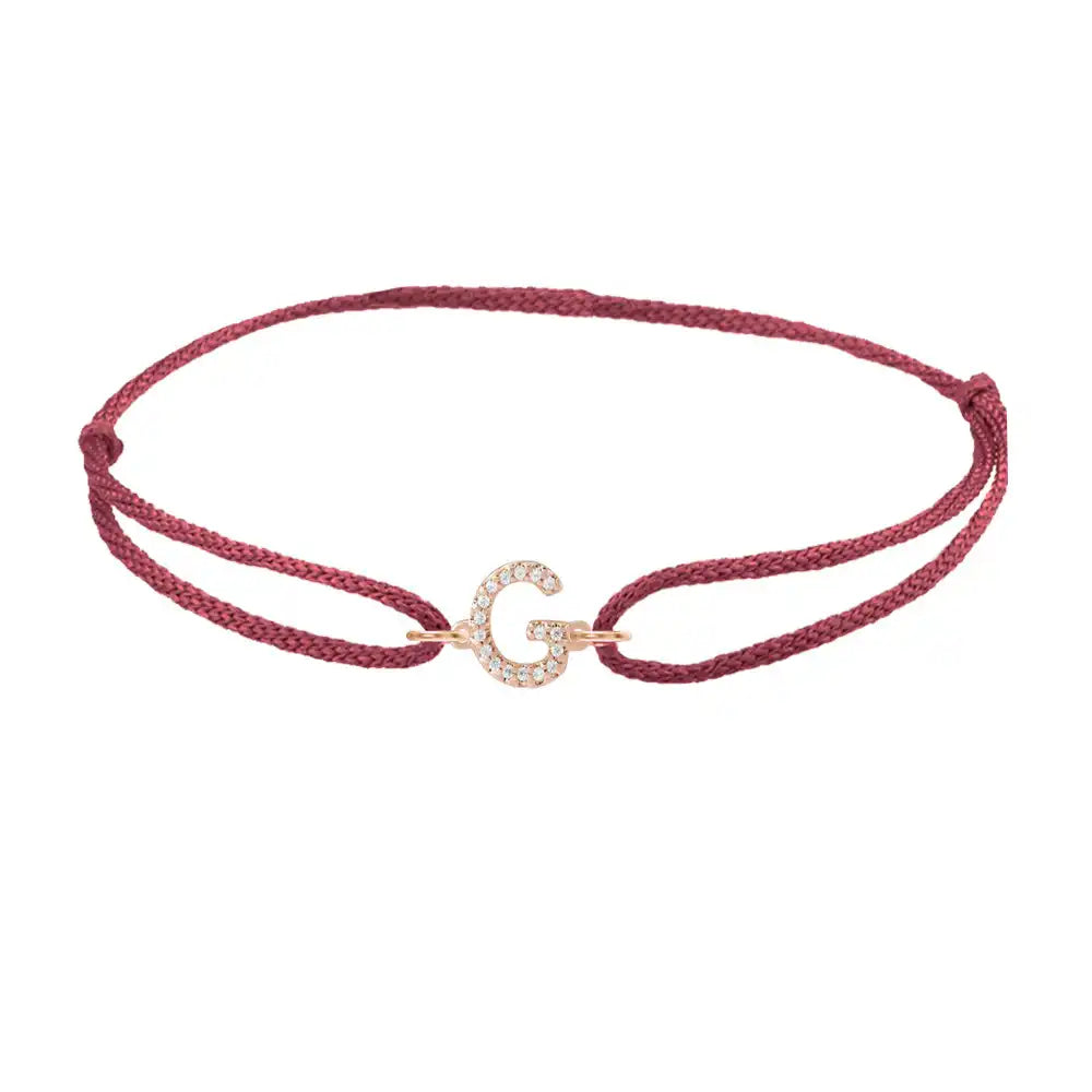 Diamond initial g silk bracelet in 14K rose gold on burgundy silk