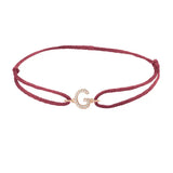 Diamond initial g silk bracelet in 14K rose gold on burgundy silk