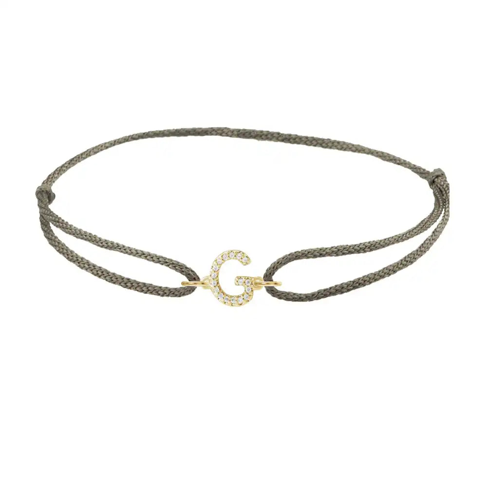 Diamond initial g silk bracelet in 14K yellow gold on olive silk