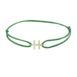 Diamond initial h silk bracelet in 14K yellow gold on emerald silk