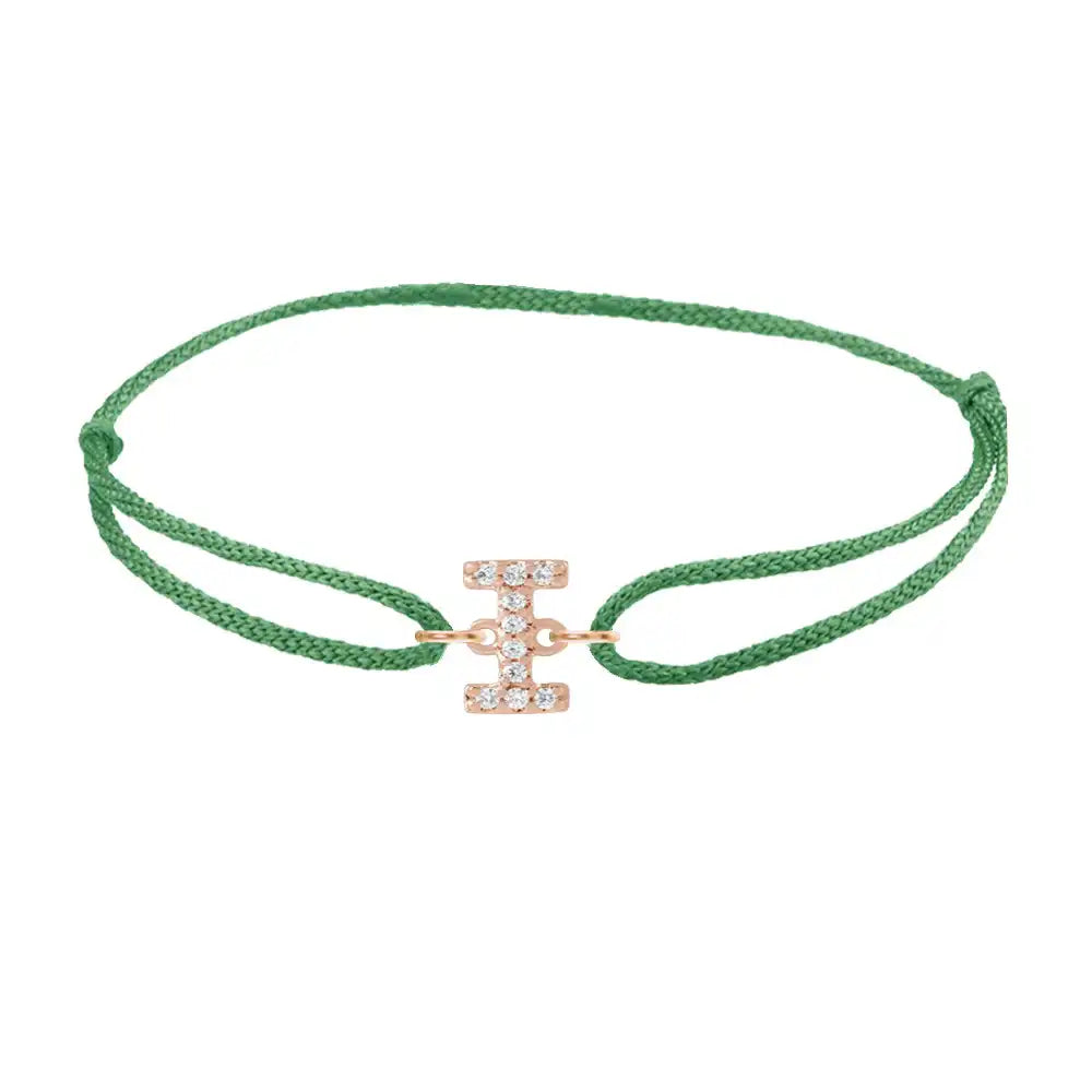 Diamond initial i silk bracelet in 14K rose gold on emerald silk