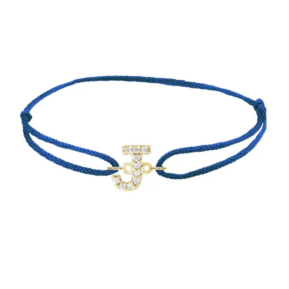 Diamond initial j silk bracelet in 14K yellow gold on blue silk