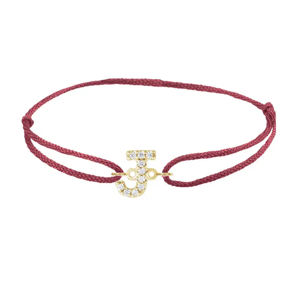 Diamond initial j silk bracelet in 14K yellow gold on burgundy silk