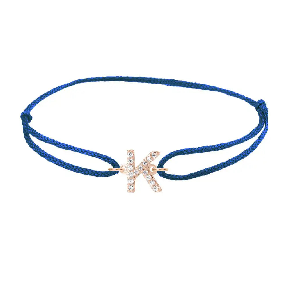Diamond initial k silk bracelet in 14K rose gold on blue silk