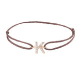 Diamond initial k silk bracelet in 14K rose gold on brown silk