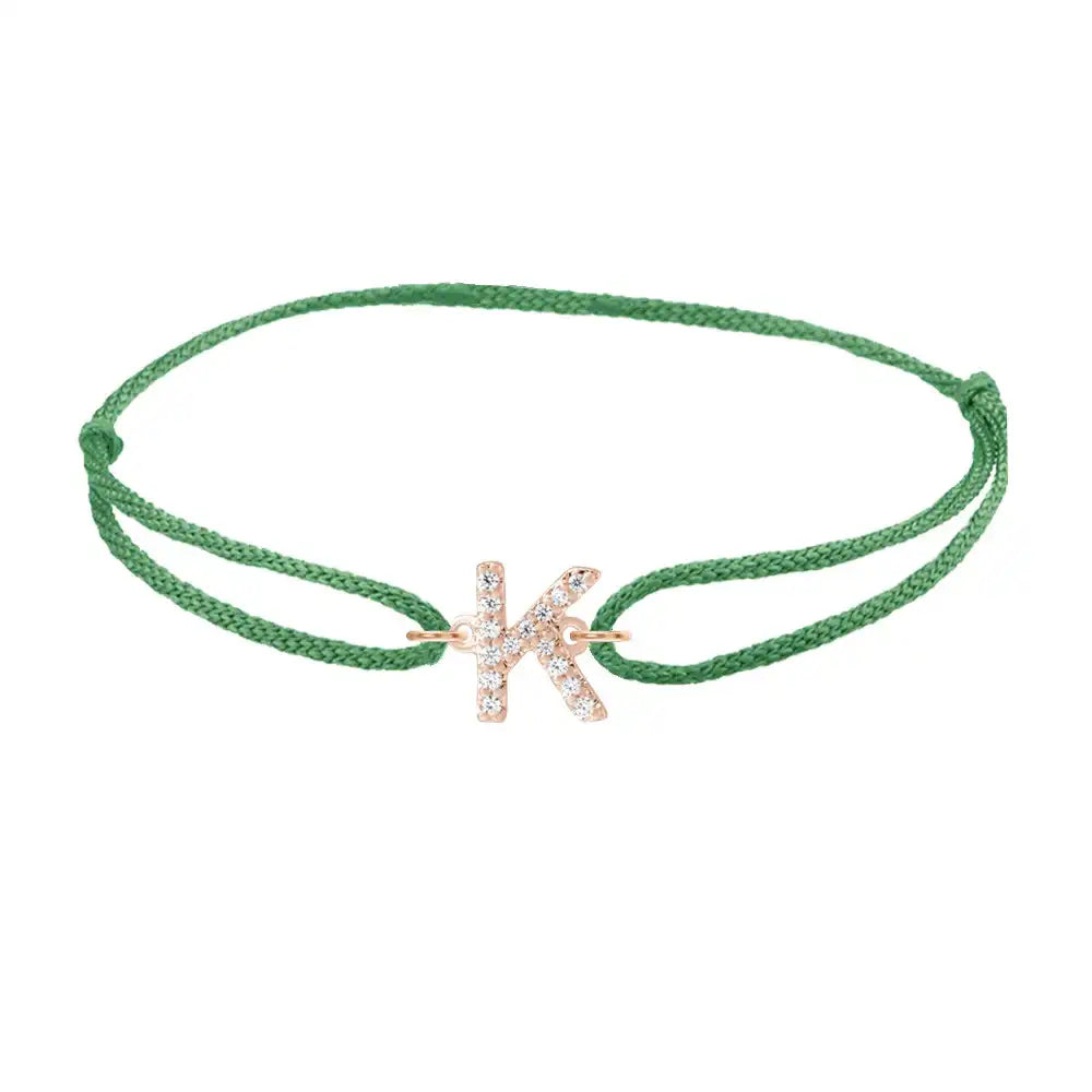Diamond initial k silk bracelet in 14K rose gold on emerald silk