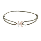 Diamond initial k silk bracelet in 14K rose gold on olive silk