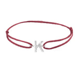 Diamond initial k silk bracelet in 14K white gold on burgundy silk