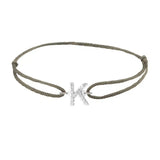 Diamond initial k silk bracelet in 14K white gold on olive silk