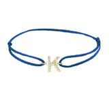Diamond initial k silk bracelet in 14K yellow gold on blue silk