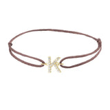 Diamond initial k silk bracelet in 14K yellow gold on brown silk