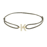 Diamond initial k silk bracelet in 14K yellow gold on olive silk