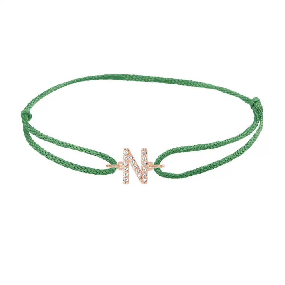 Diamond initial n silk bracelet in 14K rose gold on emerald silk
