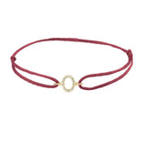Diamond initial o silk bracelet in 14K yellow gold on burgundy silk