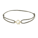 Diamond initial q silk bracelet in 14K yellow gold on olive silk