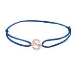 Diamond initial s silk bracelet in 14K rose gold on blue silk