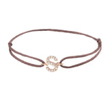 Diamond initial s silk bracelet in 14K rose gold on brown silk