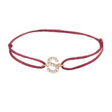 Diamond initial s silk bracelet in 14K rose gold on burgundy silk