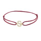 Diamond initial s silk bracelet in 14K yellow gold on burgundy silk