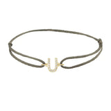 Diamond initial u silk bracelet in 14K yellow gold on olive silk
