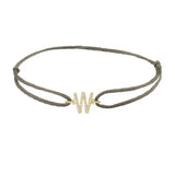 Diamond initial w silk bracelet in 14K yellow gold on olive silk