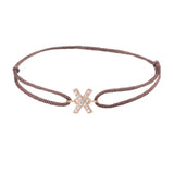 Diamond initial x silk bracelet in 14K rose gold on brown silk