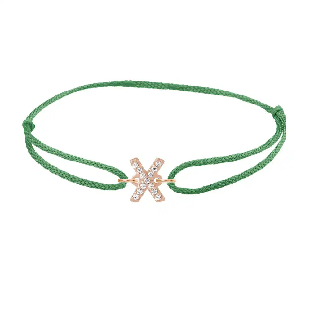 Diamond initial x silk bracelet in 14K rose gold on emerald silk