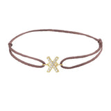 Diamond initial x silk bracelet in 14K yellow gold on brown silk