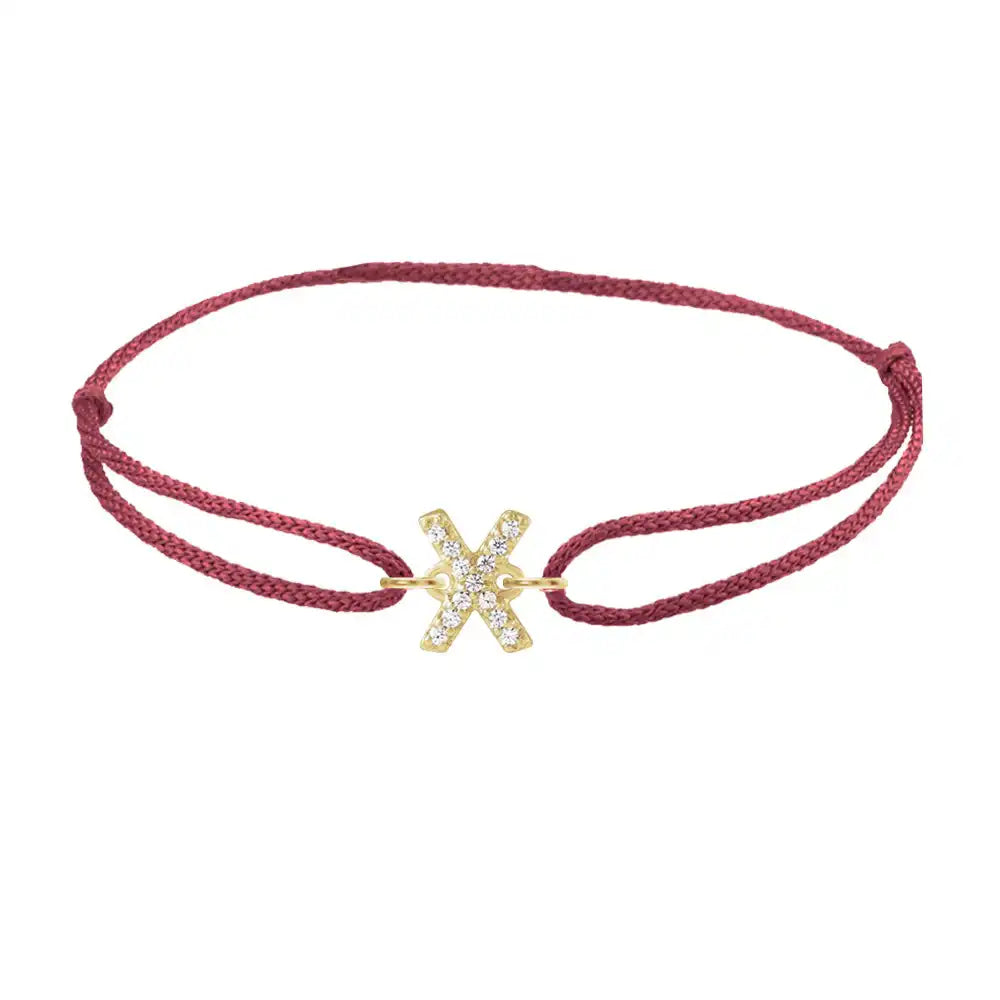 Diamond initial x silk bracelet in 14K yellow gold on burgundy silk