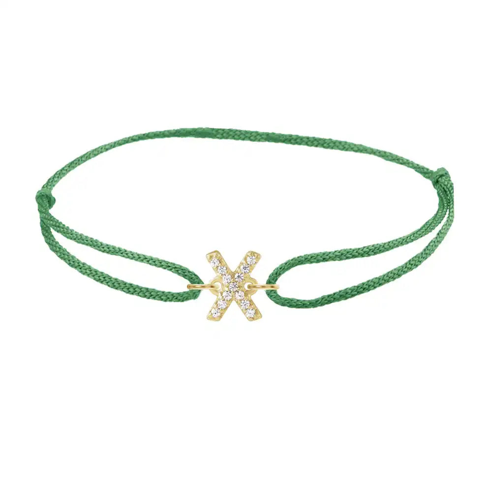 Diamond initial x silk bracelet in 14K yellow gold on emerald silk